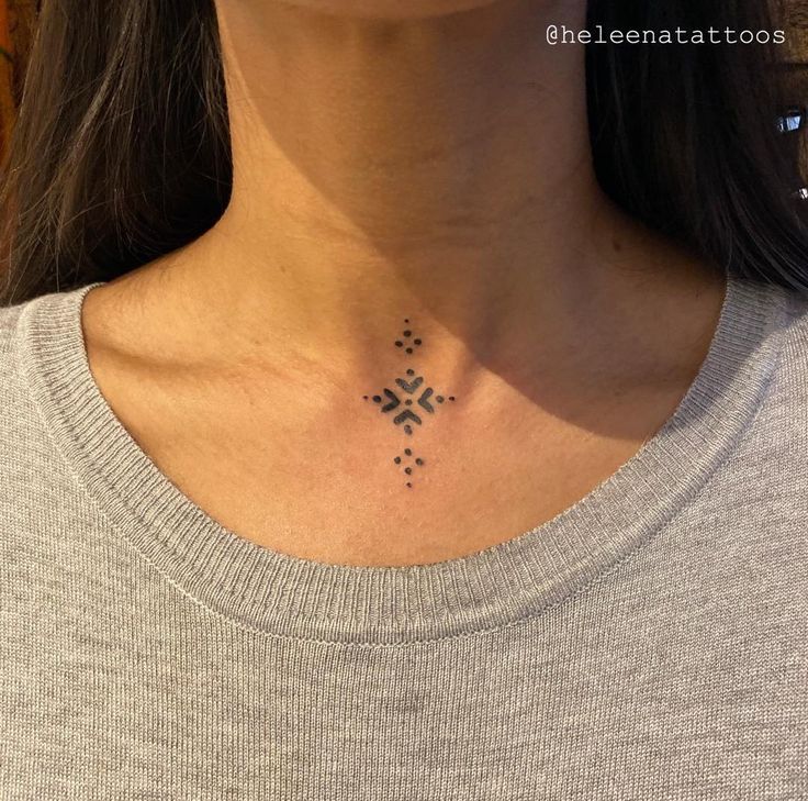 a woman with a tattoo on her neck