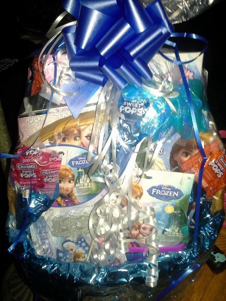 a gift basket filled with frozen princess items