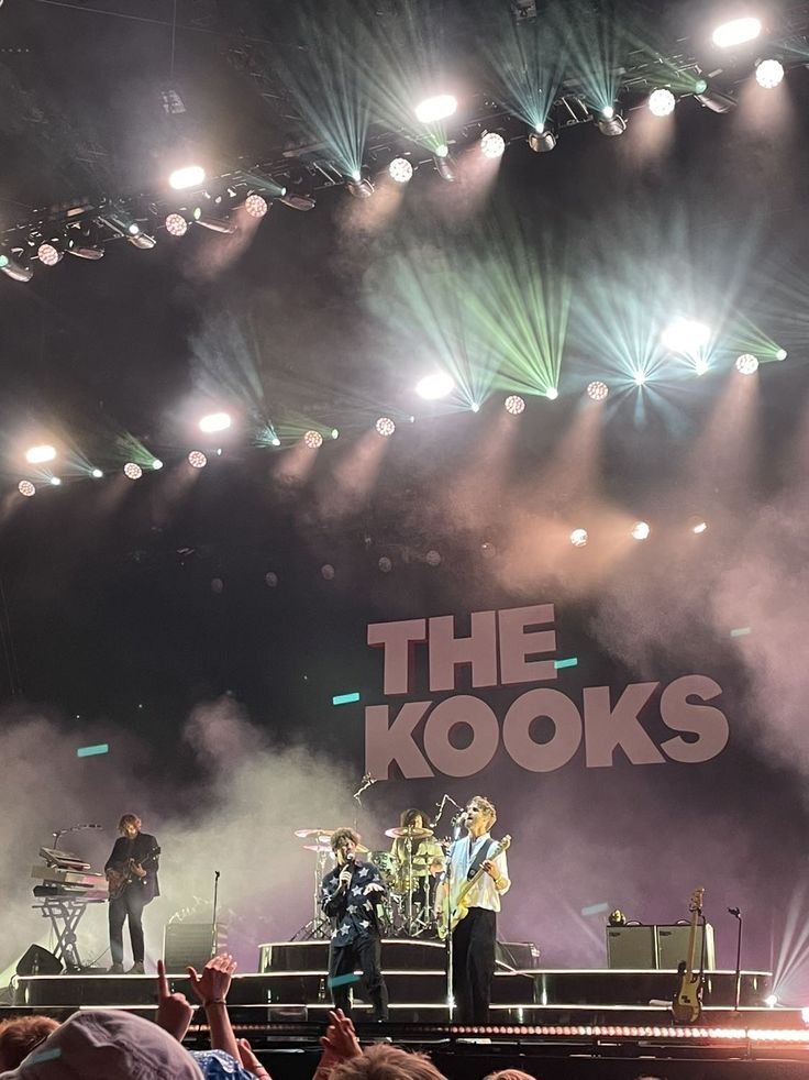 the kooks performing on stage in front of an audience at a music festival