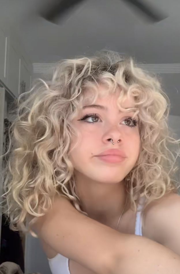 Blond Permed Hair Short, A Line Curly Haircut, Blond Curly Hair Aesthetic, Blonde Curly Hair Face Claim, Perm Ideas For Short Hair, Blonde Curly Hair Women, Shaggy Curly Hair Mid Length, Face Claims Curly Hair, Growing Out Short Curly Hair