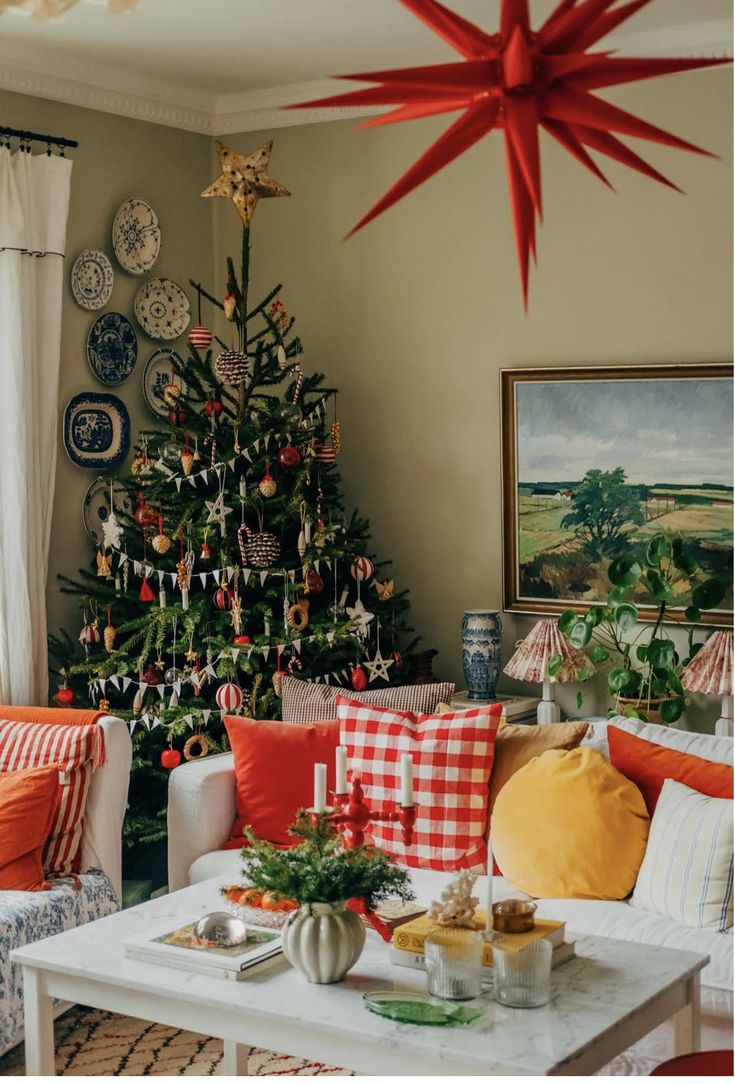 a living room with a christmas tree in the corner