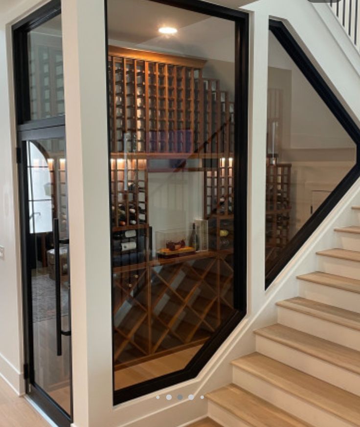 the inside of a wine cellar with stairs leading up to it