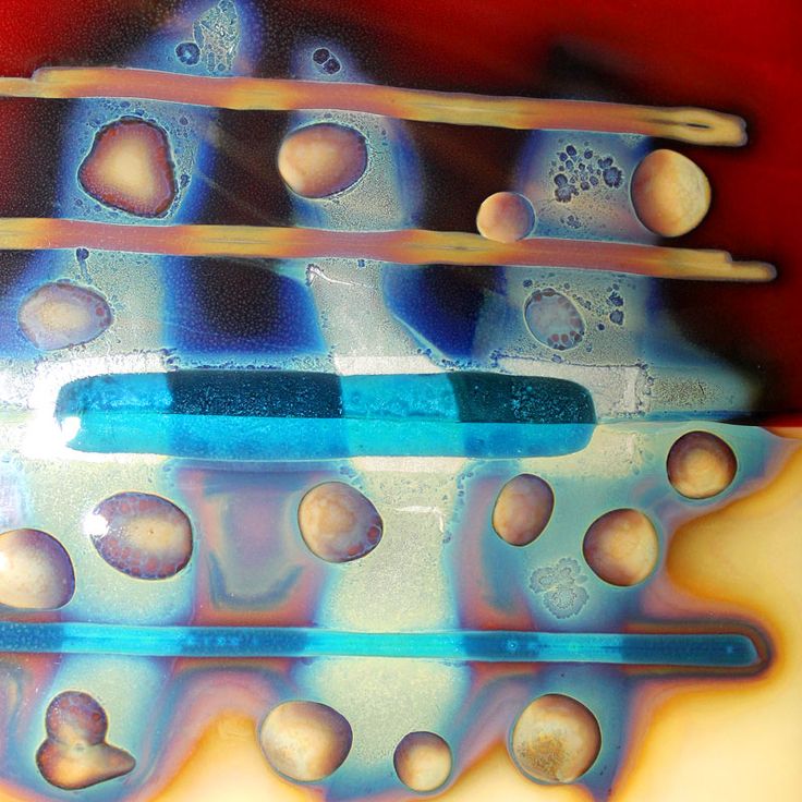 an abstract painting with blue and white bubbles on it's surface, including two toothbrushes in the foreground