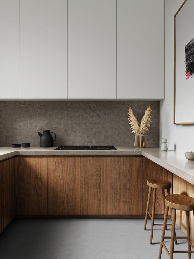 a kitchen with white cabinets and wooden stools in front of the countertop area