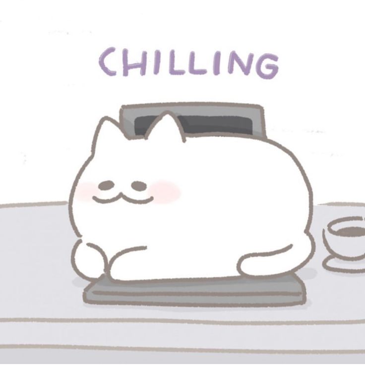 a white cat sitting on top of a table next to a cup