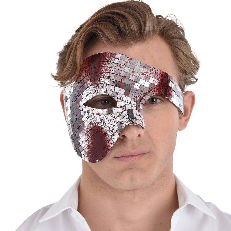 Bring some creep factor to your disco party look with this half face mask. Covered in mirrored tiles the phantom-shaped accessory covers one eye and half of your face. The glittering disco ball surface is splattered with red and black blood. pbMirrored Death By Disco Half Mask product details:-b-p ul liElastic strap-li li95% plastic and 5% spandex-li liDoes not include shirt-li liOne size fits most teens and adults-li -ul Mirrored Tile, Mask Accessories, Blood Splatter, Scary Mask, Half Mask, Half Face Mask, One Eye, Half Face, Party Look