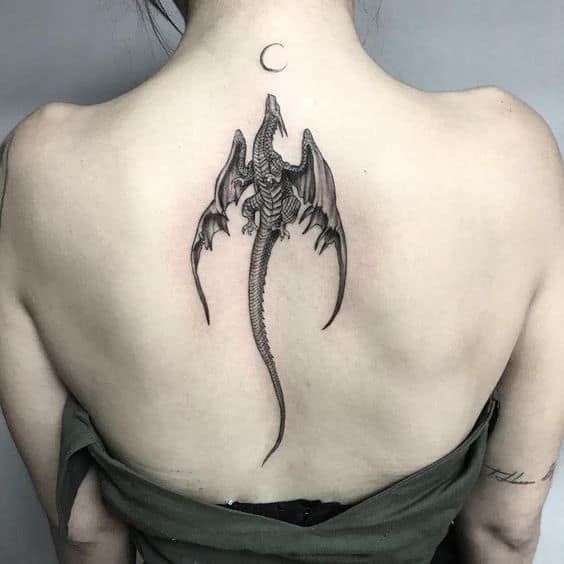 a woman with a tattoo on her back