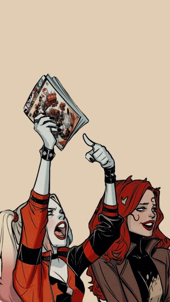 two women with their hands up in the air, one holding an object above her head