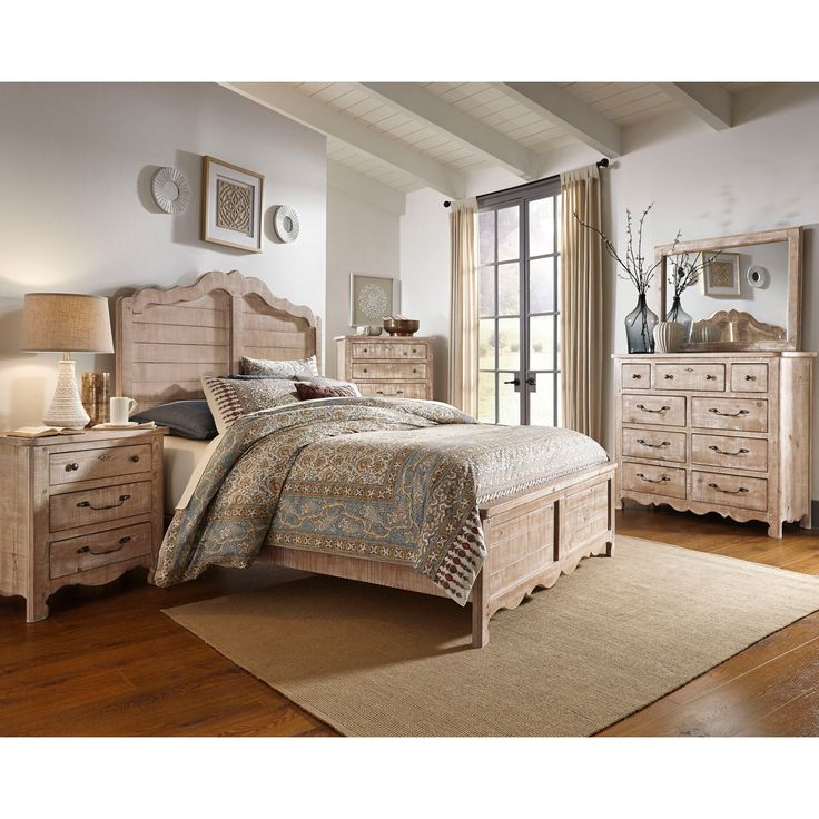 a bedroom scene with focus on the bed and dresser