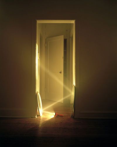 an open door with the light shining through it