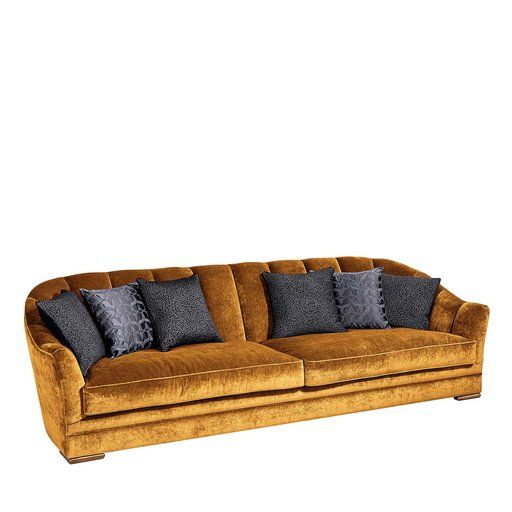 a brown couch with blue pillows on it