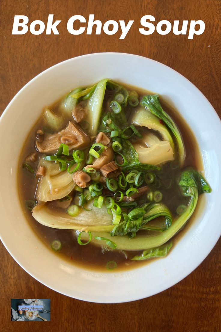 a white bowl filled with soup on top of a wooden table