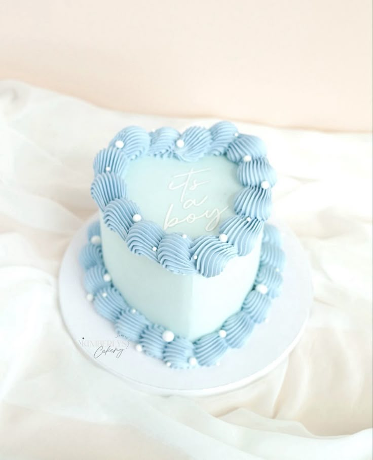 Heart cake, blue, it’s a boy lettering Baby Sprinkle Cake Boy, Blue Cakes For Boys, Heart Baby Shower Cake, Baby Blue Birthday Cake, Small Baby Shower Cake, Baby Blue Heart Cake, Heart Cake Blue And White, Simple Heart Cake, Light Blue Birthday Cake