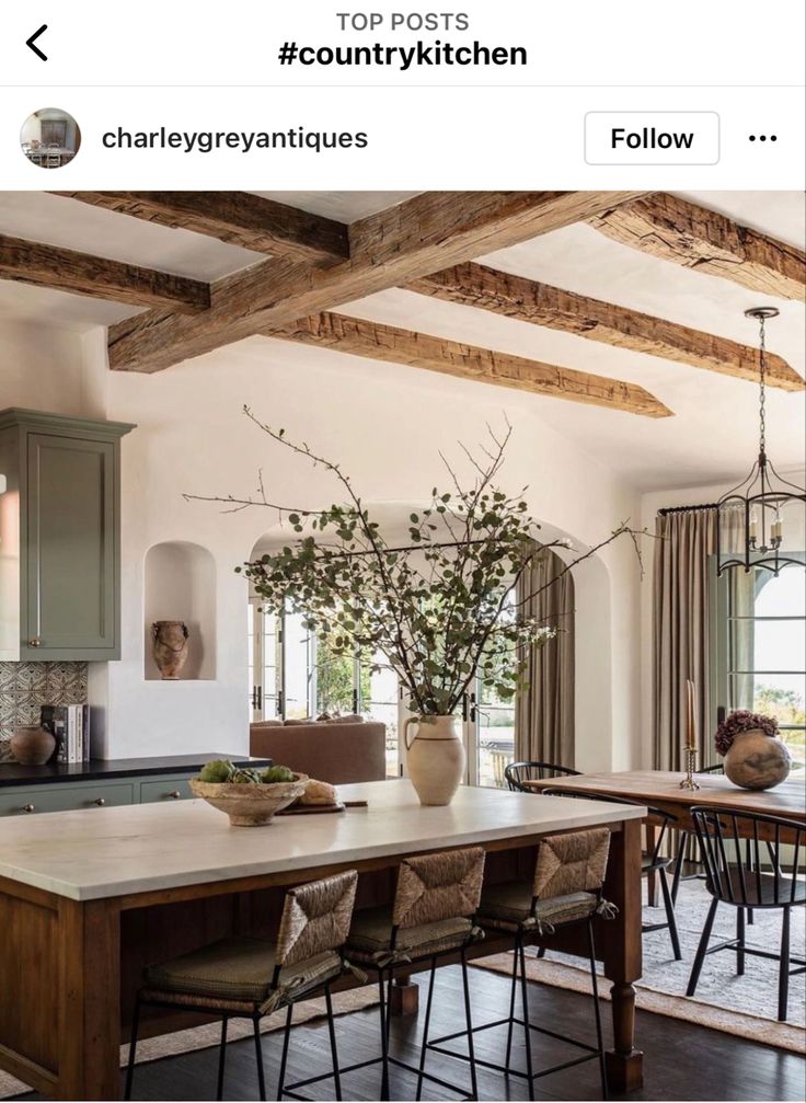 an instagram page with a kitchen and dining room in the backround area