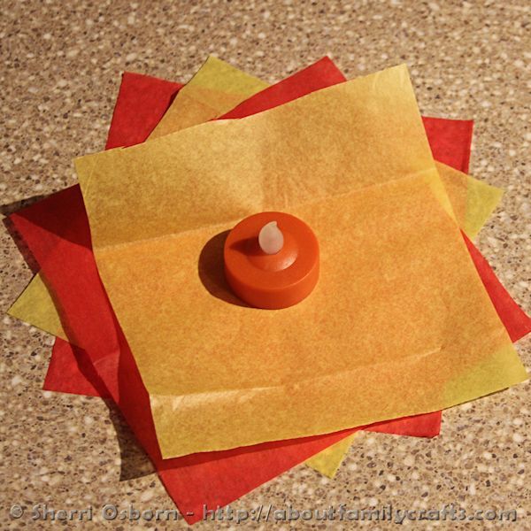 an orange object on top of some yellow paper