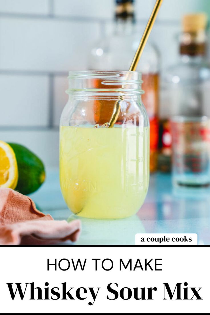 a jar filled with lemonade sitting on top of a counter