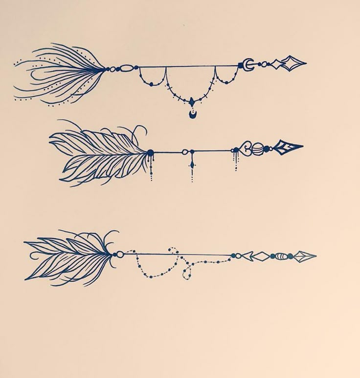 three arrows with chains and beads hanging from them