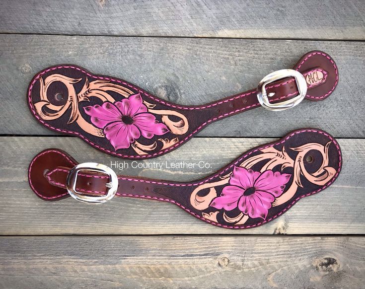 two pink flowers on brown leather straps