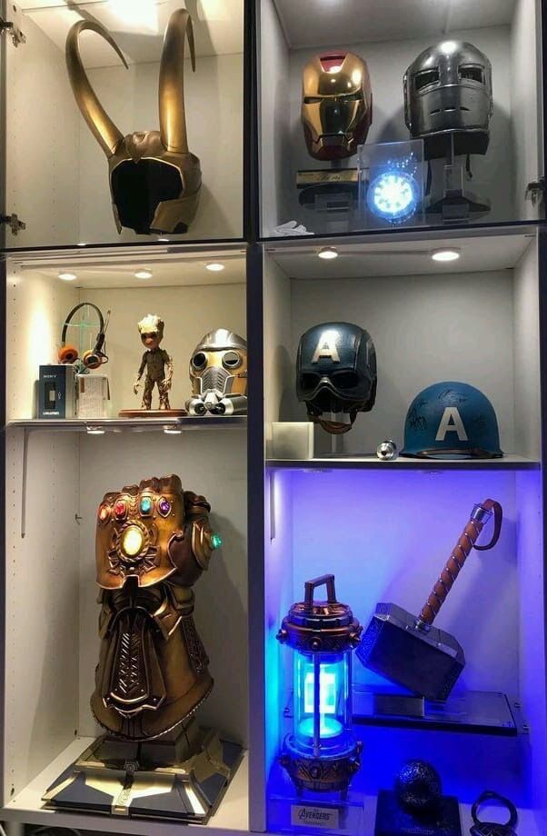 a display case filled with lots of different types of helmets