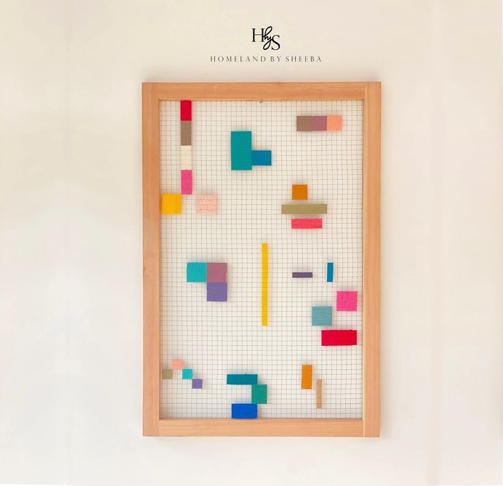 a wooden frame with colored squares on it