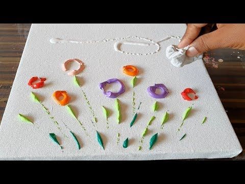 someone is painting flowers on a white board