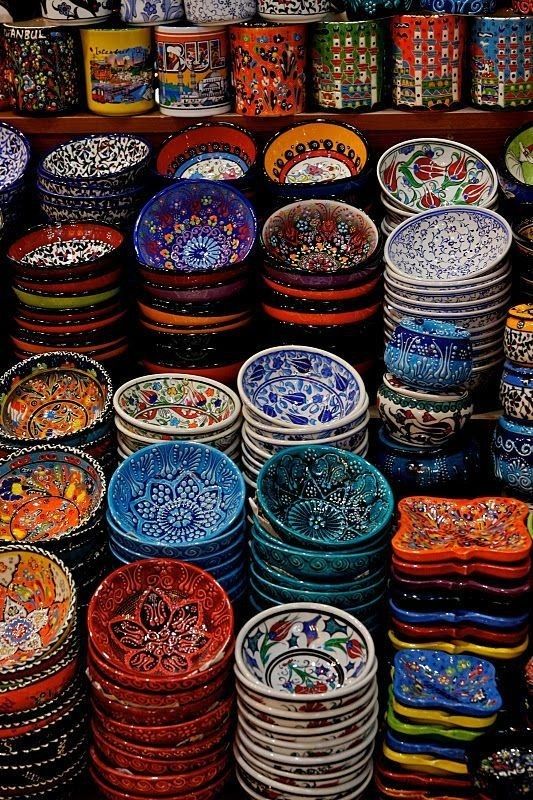 many colorful bowls are stacked on top of each other