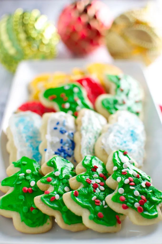 decorated christmas cookies on a white plate