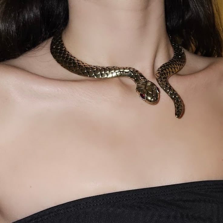 serpent, gold jewellery, gold necklace, snake jewellery, snake necklace, medusa, goddess aesthetic, dark feminine, dark feminine aesthetic, dark hair, pale skin, decolletage Gold Snake Accessories, Snake Girl Aesthetic, Snake Charmer Aesthetic, Snake Outfit Aesthetic, Dark Feminine Accessories, Snake Necklace Aesthetic, Snake Necklace Gold, Dark Feminine Jewelry, Snake Jewelry Aesthetic