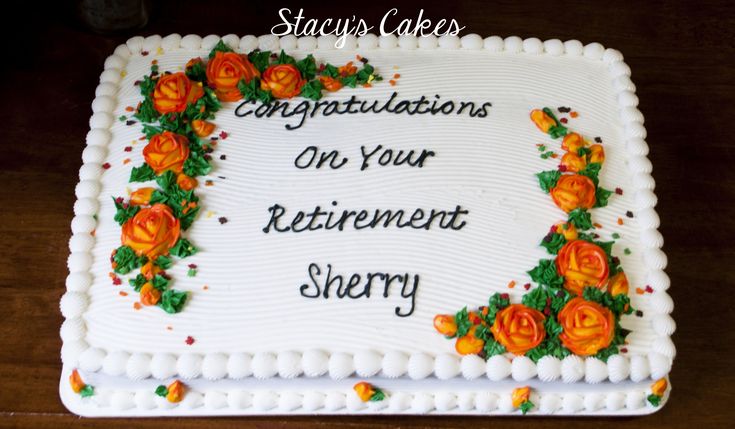 a sheet cake decorated with flowers and congratulations on your retirement slivery written in white frosting