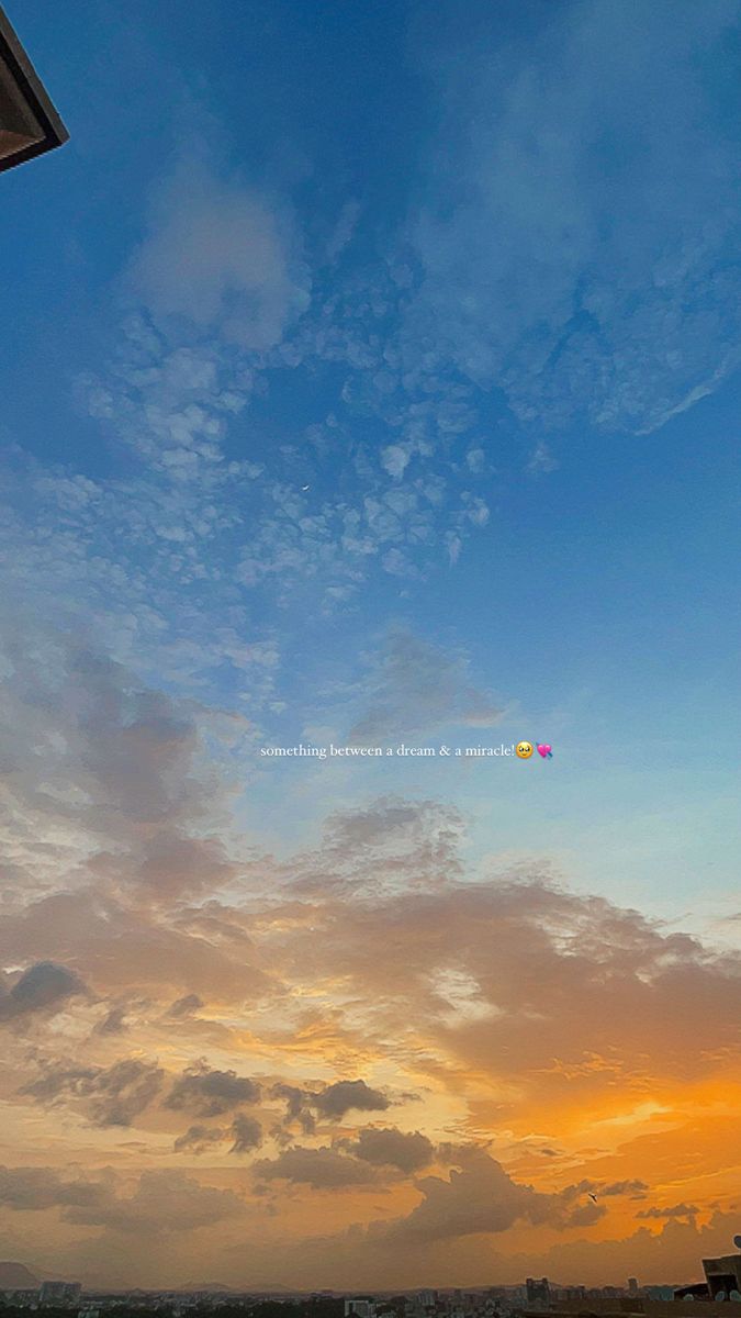 a kite flying high in the sky at sunset or dawn with clouds and blue sky