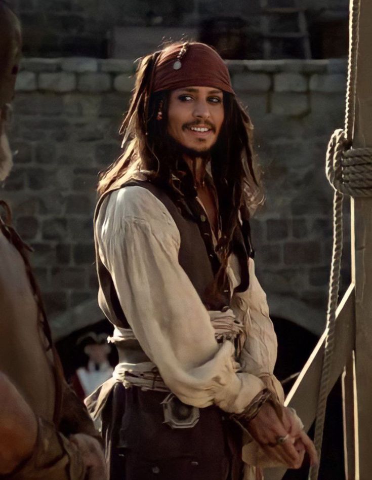 a man dressed as captain jack sparrow on the set of disney's pirates of the caribbean