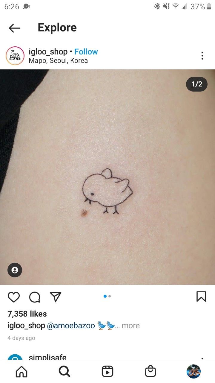 a small bird tattoo on the stomach