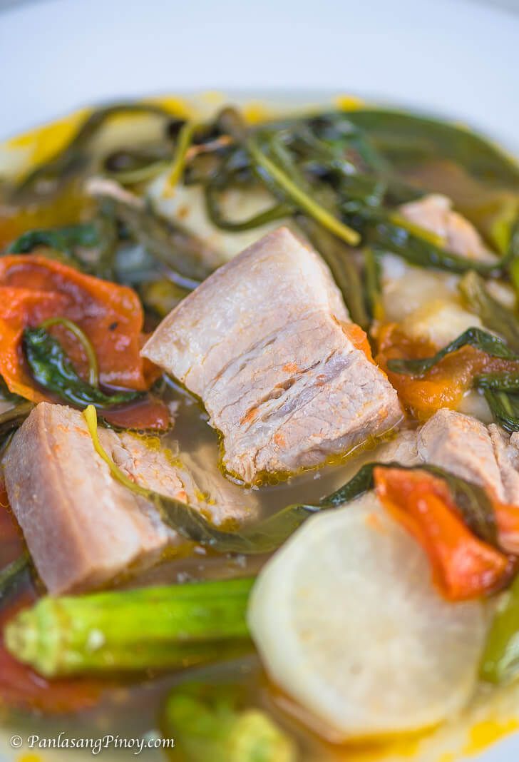 a white plate topped with meat and veggies