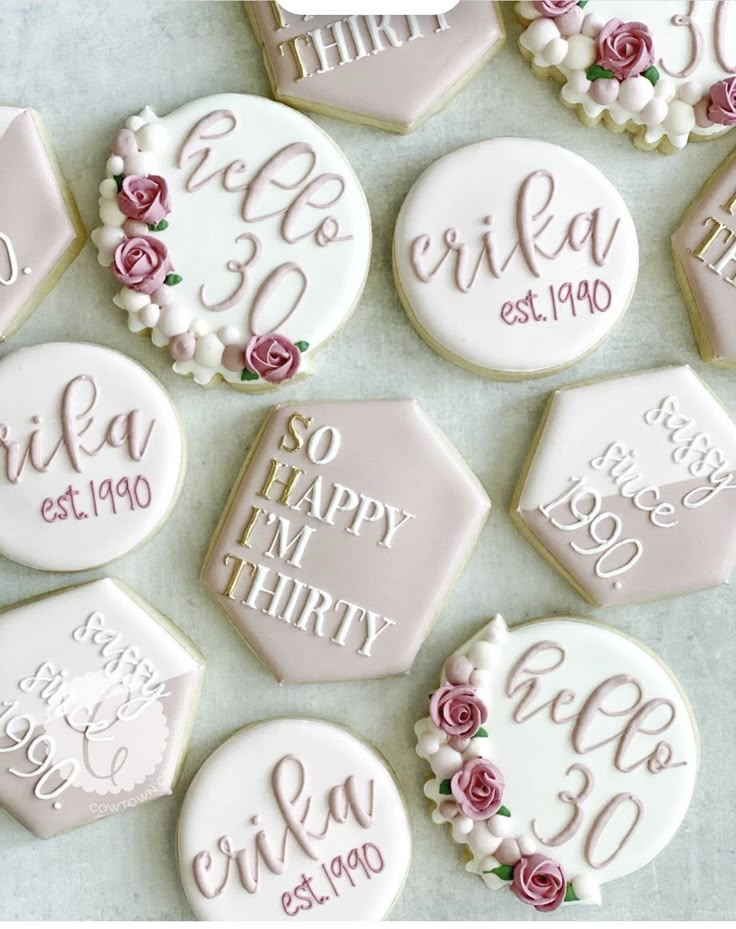 decorated cookies with wedding date and names on them are arranged in the shape of hexagons