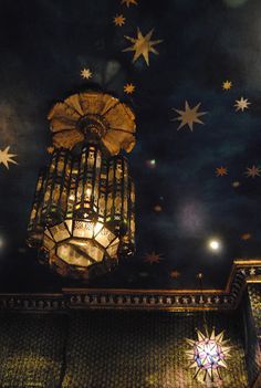 the ceiling is decorated with stars and lights