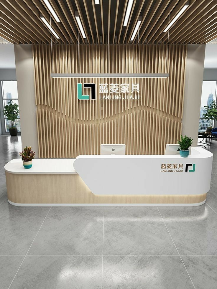 an office lobby with a reception desk and planters on the counter, in front of a wooden slatted wall