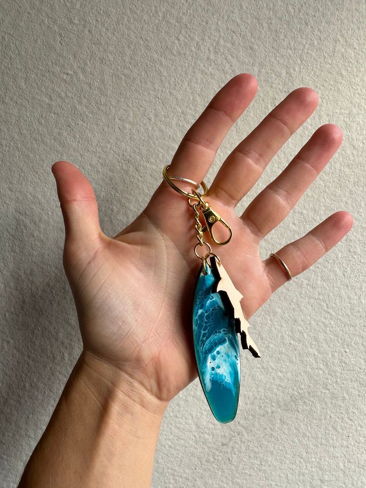 Hand made mini surfboard keychains! perfect for the surfer or beach lover... but watch out for sharks! Never loose your keys in your bag as this surfboard stands out! made with swirling blue resin and lightweight birch wood! it comes with a clasp closure to easily attach to your bag, belt loop, or other keychains! Mini Surfboard, Surfboard Stand, Surfboard Art, Bouquet Preservation, Gold Waves, Bag Belt, Beach Tropical, Beach Lover, Tropical Style