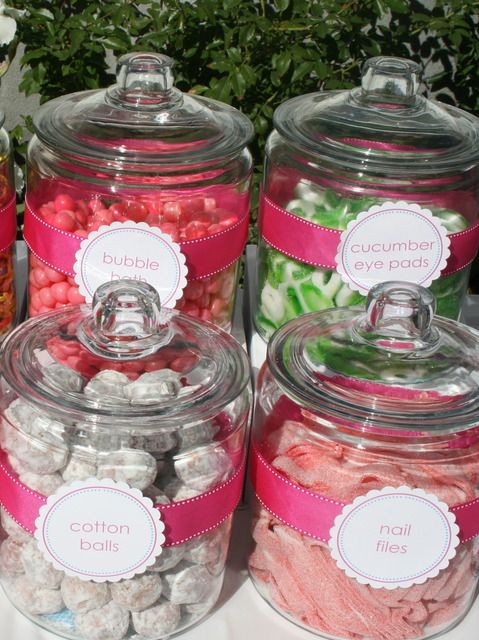 there are many different types of candies in glass jars