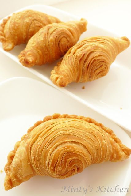 three pastries sitting on top of white plates