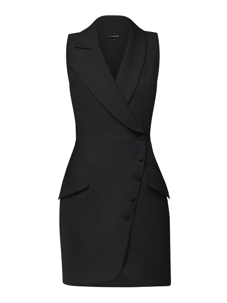 This blazer mini dress offers a chic take on power dressing with its structured cut that delivers timeless elegance, while its asymmetric lapels and double-breasted button closure add a contemporary touch.  The design is cinched at the waist and detailed with flap pockets to create an elegant, structured silhouette. Mindfully made from a luxurious stretch crêpe fabric, it is fully lined with silky satin for a smooth glide.  It is a sartorial chameleon, perfect for those who love their fashion with a side of versatility. Hand wash only. Wash inside out with like colours. Do not wring or twist. Do not tumble dry. Iron at 160°C max or use press cloth. Do not bleach. Professional dry clean. Dresses Office Wear, Black Graduation Dress College Classy, Monochrome Dress, Tailored Dress For Work, Business Formal Dresses, Suit Dress, Blazer Dress Outfits Classy, Black Office Dress, Blazer Dress Outfits