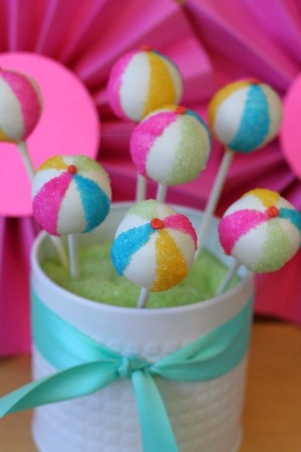 there are many candy lollipops in the cup