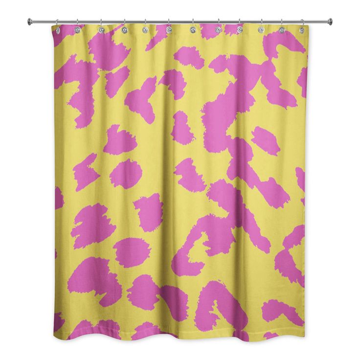 a yellow and pink shower curtain with an animal print