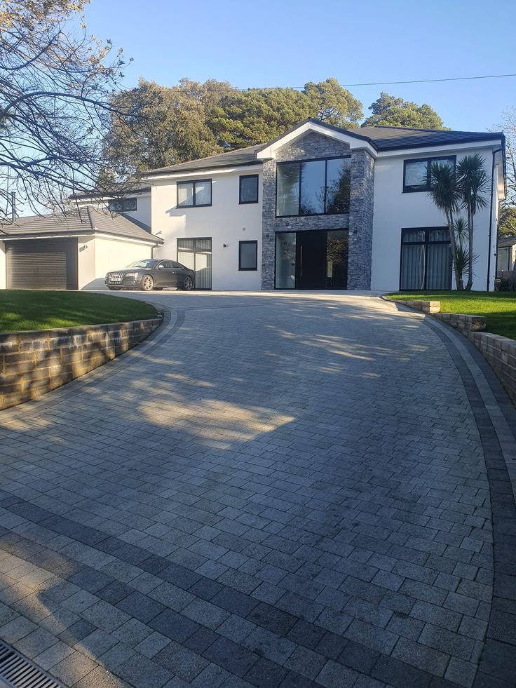 a large house with a driveway in front of it