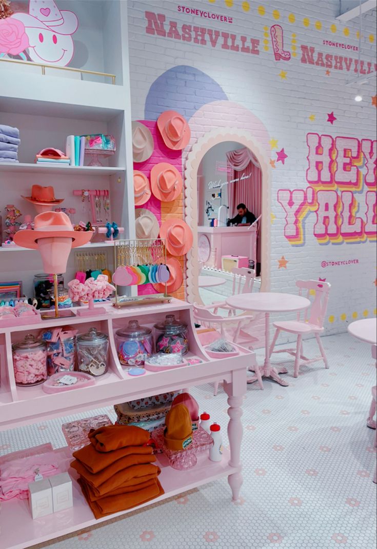 a room filled with pink furniture and accessories