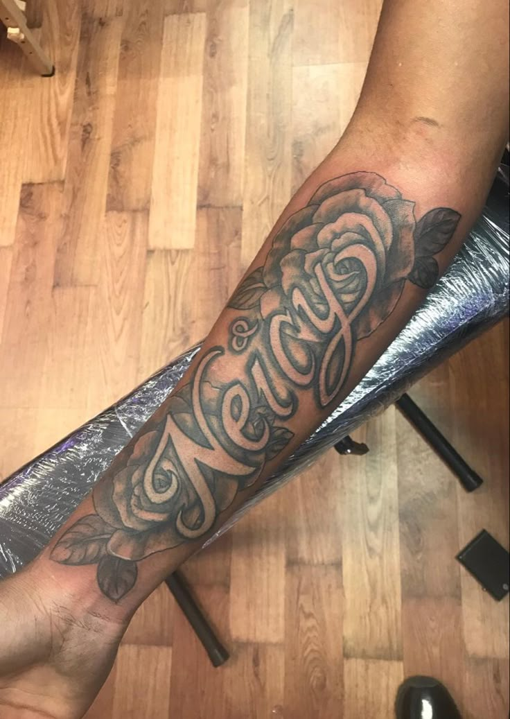 a person with a tattoo on their arm