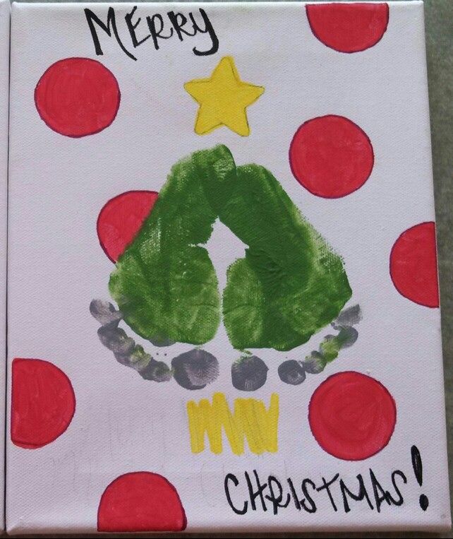 a child's handprinted christmas card with the letter m in green and red polka dots