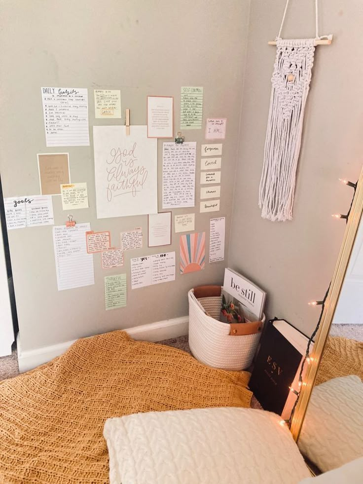 a bed with lots of notes on the wall