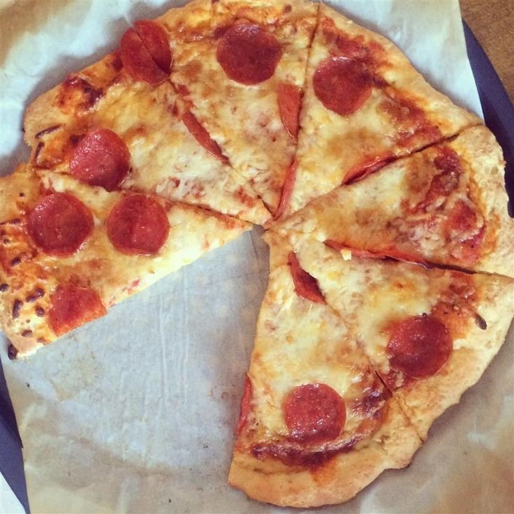 the pizza is cut into four pieces and ready to be eaten