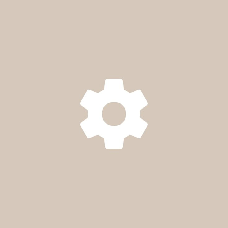 an image of a white gear wheel on a beige background with space for your text