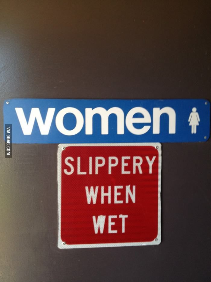 a blue and white sign that says women slippery when wet on the side of a door